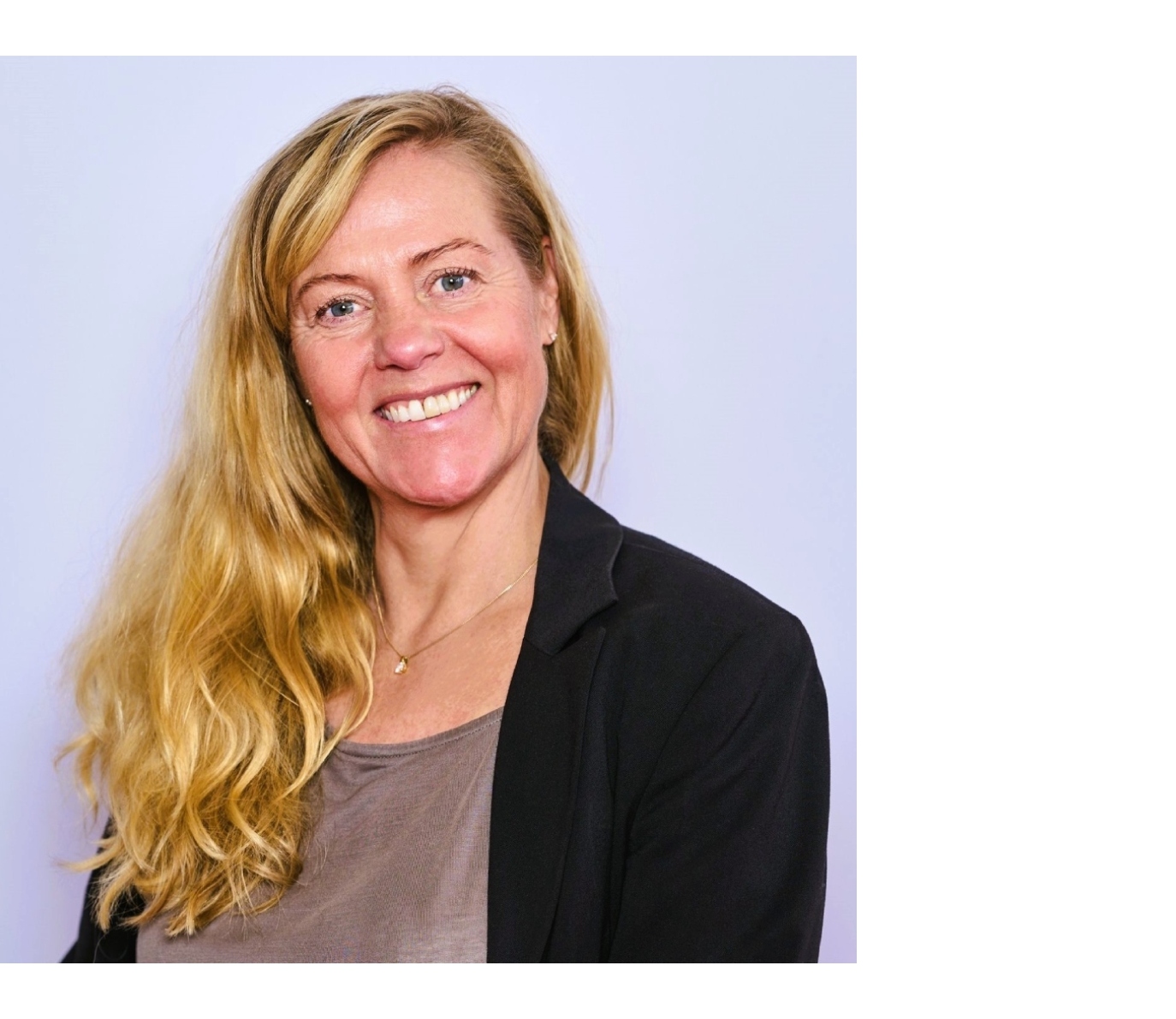 a smiling woman with blond hair
